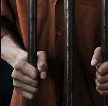 man behind prison bars
                  