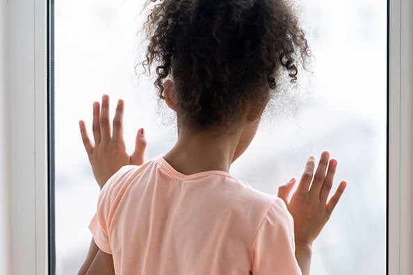 girl looking out window